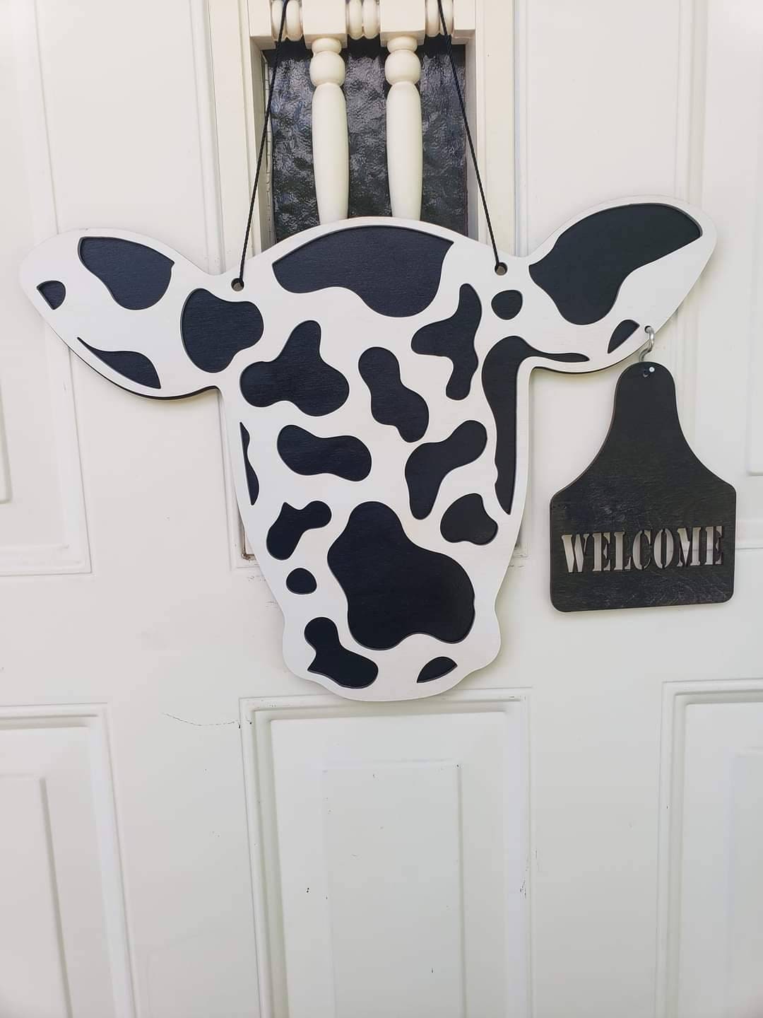 Cow head door sign. Ear tag changes. Welcome and Hay Ya'll