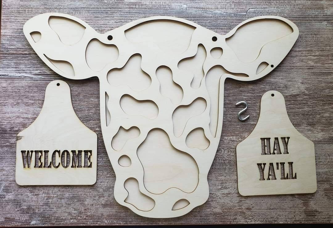 Cow head door sign. Ear tag changes. Welcome and Hay Ya'll